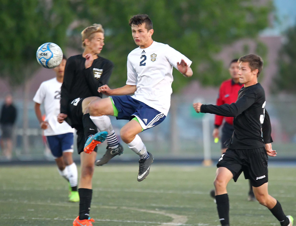 Kaden Wittwer (2) goes after the ball for the Warriors, Desert Hills vs. Snow Canyon, Soccer, St. George, Utah, Apr. 7, 2015 | Photo by Robert Hoppie, ASPpix.com, St. George News