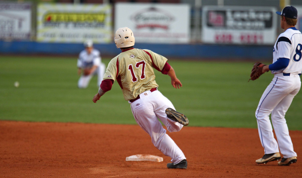 Cedar's Ryan Slack (17) heads for second base as the ball gets into the outfield, Cedar vs. Dixie, Baseball, St. George, Utah, Apr. 10, 2015 | Photo by Robert Hoppie, ASPpix.com, St. George News