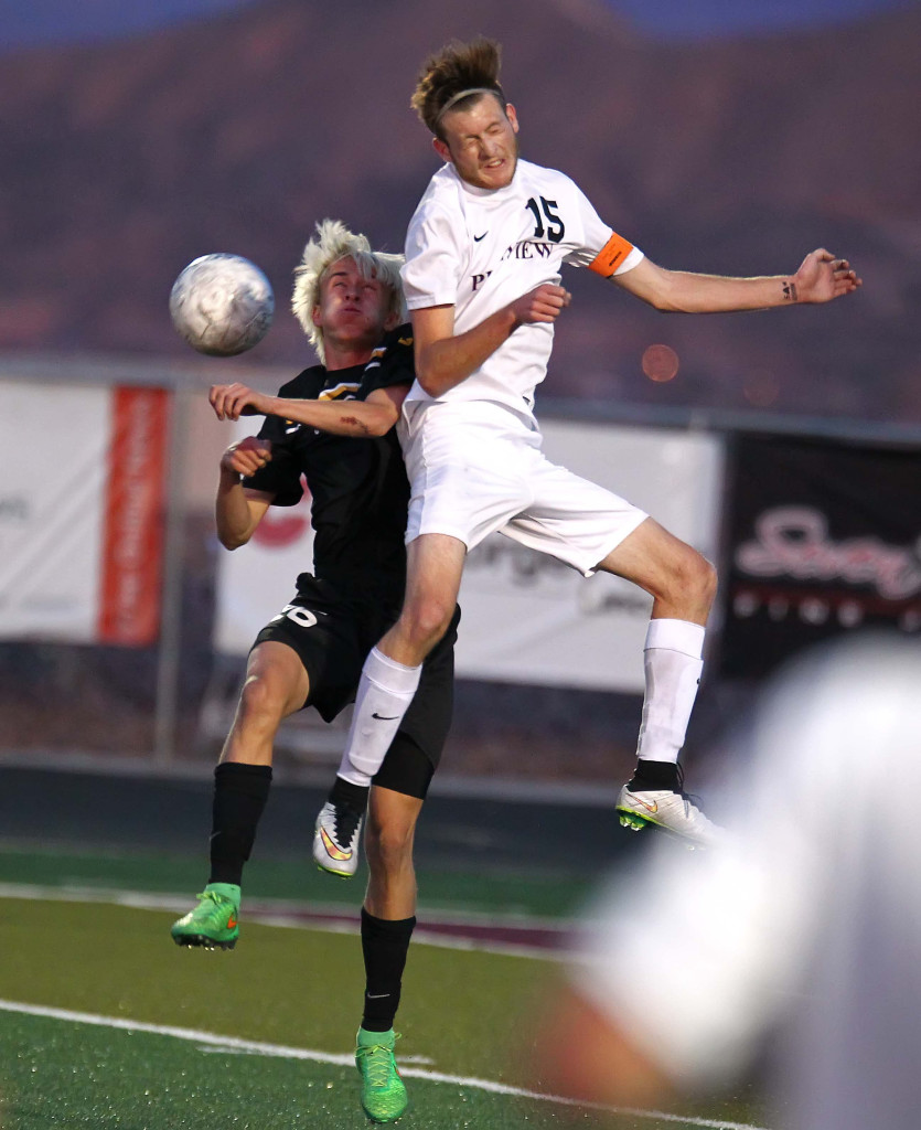 Desert Hills' Kanon Heaton and Pine View's Ethan Baer (15) leap for a header, Desert Hills vs. Pine View, Soccer, St. George, Utah, Apr. 10, 2015 | Photo by Robert Hoppie, ASPpix.com, St. George News