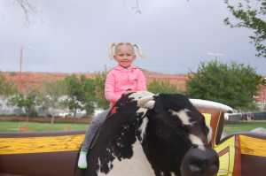 Adyson Christensen rides the mechanical bull at the Southern Utah Culinary Festival held at Vernon Worthen Park, St. George, Utah, April 24, 2015 | Photo by Hollie Reina, St. George News