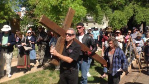 Solomon's Porch Foursquare Fellowship  Pastor Jimi Kestin carries a cross in the Stations of the Cross walk, St. George, Utah, April 3, 2015 | Photo by Holly Coombs, St. George News