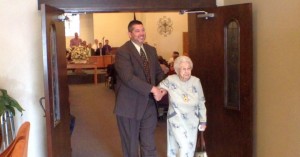 Westside Baptist Church Pastor Greg Wright escorts Lillian Grant, soon to be 100 years old, from Sunday service, Westside Baptist Church, St. George, Utah, April 5, 2015 | Photo by Ric Wayman, St. George News