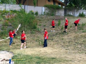 Keller-Williams agents working to clear weeds as part of their "Red Day" at SwitchPoint Community Resource Center, St. George, Utah. Thursday, May 14, 2015 | Photo courtesy of Keller-Williams Realty, St. George News