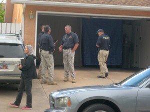 Police officers gather in the driveway of the missing girl's grandmother's house, St. George, Utah, Sunday May 24, 2015 | Photo by Ric Wayman, St. George News