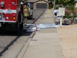 Santa Clara Fire Department responds to a bee colony in a water meter box, Santa Clara, Utah, May 14, 2015 | Photo by Julie Applegate, St. George News
