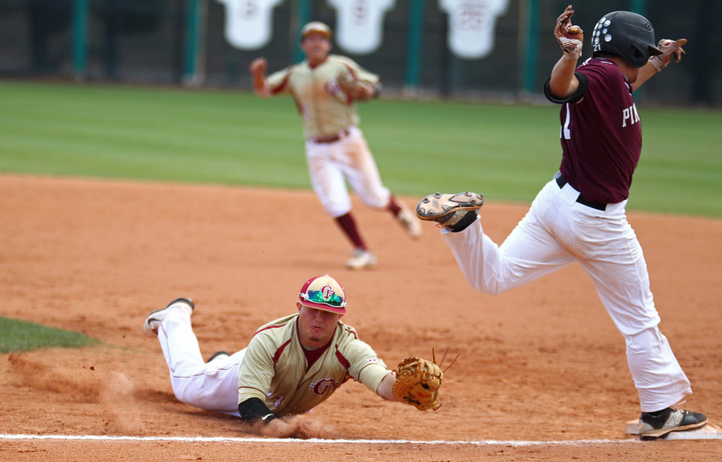 Cedar first baseman Brecken Lewis dives to tag Pine View's Brooks Barney, Barney avoided the tag and was called safe, Pine View vs. Cedar, 3A State Baseball Championship Game, St. George, Utah, May 16, 2015 | Photo by Robert Hoppie, ASPpix.com, St. George News