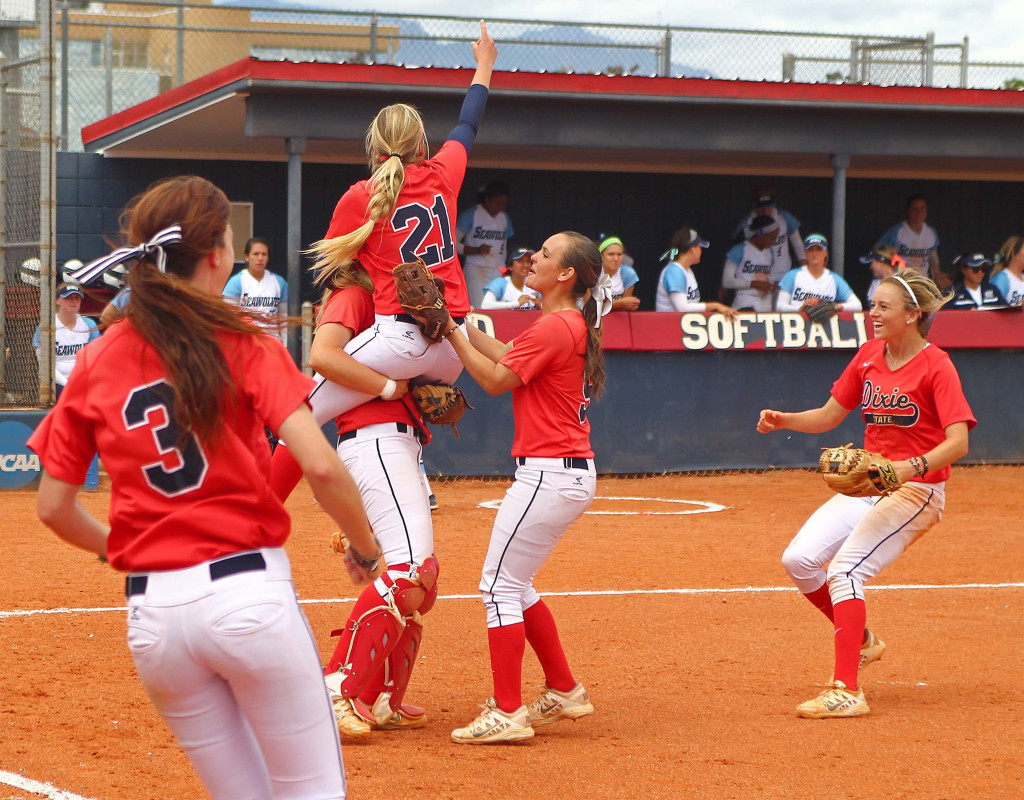 Dixie State players, including Michelle Duncan (21), celebrate their win in the Super Regional tournament, Dixie State University vs. Sonoma State University, Softball, St. George, Utah, May 16, 2015 | Photo by Robert Hoppie, ASPpix.com, St. George News