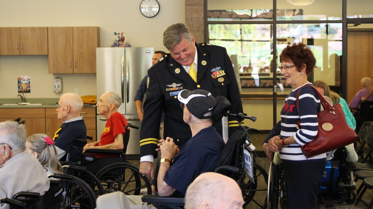 Ski Ingram, speaking to one of the veteran-residents at the Southern Utah Veterans Home, following a Memorial Day program, Ivins, Utah, May 25, 2015 | Photo by Mori Kessler, St. George News