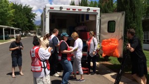 Red Cross staff and volunteers gather at the Red Cross van relief van to discuss the morning's canvassing, Washington City, Utah, May 16, 2015 | Photo by Mori Kessler, St. George News