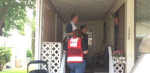 Red Cross volunteers asking a King's Row Estates resident if he needs new smoke alarms, Washington City, Utah, May 16, 2015 | Photo by Mori Kessler, St. George News