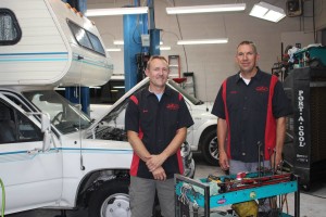 (L-R) Evan Jenkins and Sonny Cheser in Pro Auto Care shop, July 2, 2015, St. George, UT | Photo by Sheldon Demke, St. George News