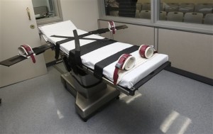 FILE - This Oct. 9, 2014, file photo shows the gurney in the the execution chamber at the Oklahoma State Penitentiary in McAlester, Okla. On Monday, June 29, 2015, The Supreme Court voted 5-4 in a case from Oklahoma saying that the sedative midazolam can be used in executions without violating the Eighth Amendment prohibition on cruel and unusual punishment.. (AP Photo/Sue Ogrocki, File)