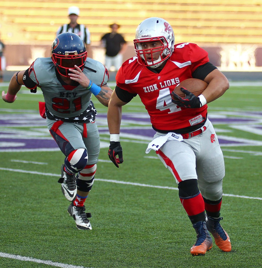 Matt Fuela (4) carries the ball for the Lions during last year's championship game, Zion Lions vs. Wasatch Revolution, Ogden, Utah, June 27 2015, | Photo by Robert Hoppie, ASPpix.com, St. George News