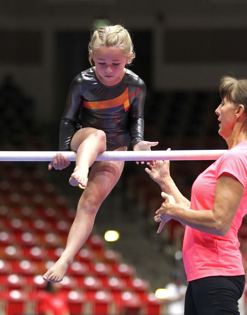 Sadie Gunther is helped by coach Beth Julian, Utah Summer Games, Gymnastics, Cedar City, Utah, June 13, 2015, | Photo by Robert Hoppie, ASPpix.com, St. George News