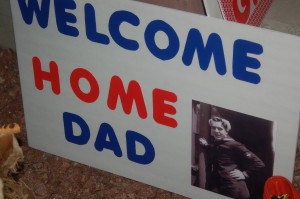 Families bring welcome home signs to greet their loved ones as they return from the Utah Honor Flight trip, St. George, Utah, June 6, 2015 | Photo by Hollie Reina, St. George News
