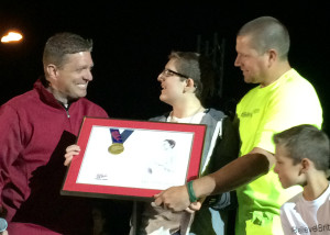 Britton Shipp receives the Spirit of Games award for his outstanding triumphs through hardships and love of sports at the 30th annual Utah Summer Games Opening, Southern Utah University Eccles Colliseum, Cedar City, Utah, June 11, 2015 | Photo by Carin Miller, St. George News