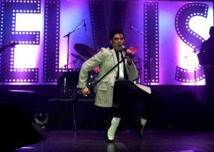 Jacob Roman does his impersonation of the King at the 2015 Event director Krissy Ayon explains the rules of the Elvis Rocks Mesquite competition to the audience, Casablanca, Mesquite, Nevada, June 20, 2015 | Photo by Carin Miller, St. George News