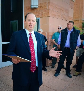 Attorney Mark James explains the details of an auction for Warren Jeffs' Cadillac Escalade on the steps of the 5th District courthouse, St. George, Utah, June 15, 2015 | Photo by Kimberly Scott, St. George News