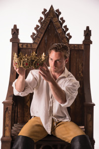 Actor examining a crown, Cedar City, Utah, undated | Photo courtesy of Utah Shakespeare Festival, St. George News