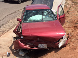 A drowsy driver crashed into a concrete barrier on Bluff Street, sending her to the hospital, St. George, Utah, June 23, 2015 | Photo courtesy of Tyler Truman, St. George News