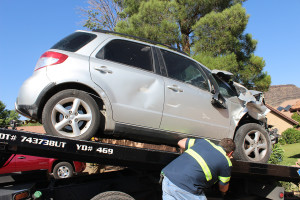 Damage to a Suzuki SX4 after it crashed into a brick wall and house, St. George, Utah, June 2, 2015 | Photo by Nataly Burdick, St. George News