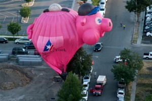 The Bank of American Fork piggy bank balloon crash lands near Utah Valley Regional Medical Center during America's Freedom Festival Balloon Fest in Provo, Utah, Thursday, July 2, 2015, |Photo by Grant Hindsley/The Daily Herald via AP, St. George News