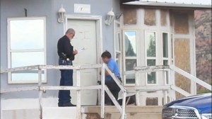 A locksmith has to pick the lock to get into a home after they refuse to open up for Constable Michael Hoggart, Colorado City, Arizona, July 7, 2015 | Photo by Nataly Burdick, St. George News