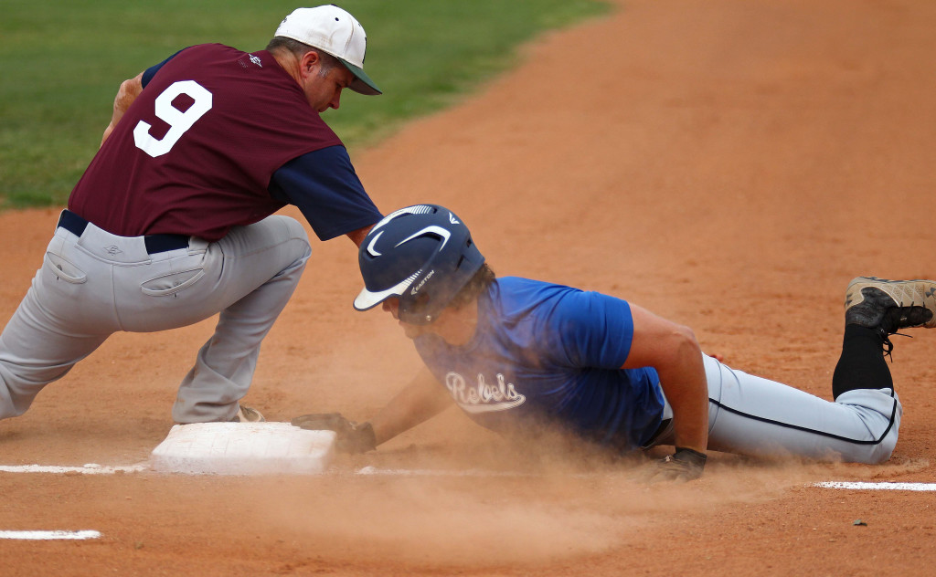 Craig Zimmerman applies the tag on a pickoff play at first base Monday night, Utah Adult Amateur Baseball League all-star game at Elks Field, St. George, Utah, July 6, 2015, | Photo by Robert Hoppie, ASPpix.com, St. George News