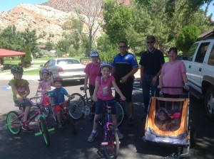 The Blodgett family, of Cedar City, were the first recipients of this year’s "Playin’ Safe" gift cards. The Blodgetts were caught by Cedar City Police officers while preparing for a bicycle ride at Cedar City’s Canyon Park. Each of the Blodgetts were practicing bicycle safety by wearing their bicycle helmets. Their safe act was rewarded by CCPD Officer Travis Carter, who issued each of the kids a Subway gift card. Cedar City, Utah, July 28, 2015 | Photo courtesy of Cedar City Police Department, St. George News