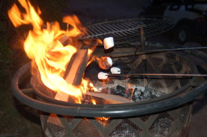 Roasting marshmallows over a contained fire pit at Zion Ponderosa Ranch Resort, Utah,  July 11, 2015 | Photo by Hollie Reina, St. George News