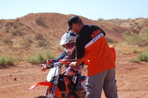 Carson Hamblin (L) and his dad, Aaron Hamblin pause during a practice session to refuel, Warner Valley, Washington City, Utah, July 17, 2015 | Photo by Hollie Reina, St. George News