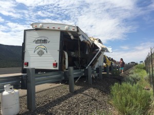 The remains of a trailer that flipped on I-15, spilling it's contents into the roadway, Washington County, milepost 36, July 6, 2015 | Photo by Devan Chavez, St. George News