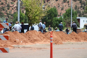 Members of the FLDS church work to build a wall around the Leroy S. Johnson Meeting House, Colorado City, Arizona, July 2, 2015 | Photo by Nataly Burdick, St. George News