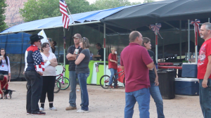 Attendees chat and catch up during the Fourth of July festivities, Colorado City, Arizona, July 4, 2015 | Photo by Nataly Burdick