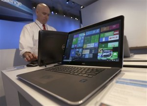 In this April 29, 2015, file photo, a Dell laptop computer running Windows 10 is on display at the Microsoft Build conference in San Francisco. Microsoft's new Windows 10 operating system debuts Wednesday, July 29, 2015, as the longtime leader in PC software struggles to carve out a new role in a world where people increasingly rely on smartphones, tablets and information stored online. Location not given, April 29, 2015 | AP Photo/Jeff Chiu, File; photo extended and left and right ends for sizing; St. George News
