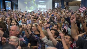 Guest and New Horizons team members count down to the spacecraft's closest approach to Pluto, at the Johns Hopkins University Applied Physics Laboratory (APL) in Laurel, Maryland. The moment of closest approach for the New Horizons spacecraft came around 7:49 a.m. EDT Tuesday, culminating an epic journey from planet Earth that spanned an incredible 3 billion miles and 9½ years, Johns Hopkins University Applied Physics Laboratory,  Laurel, Maryland, Tuesday, July 14, 2015 | Photo by Bill Ingalls NASA via AP, St. George News 