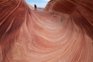 In this file photo, a hiker walks on a rock formation known as The Wave in the Vermilion Cliffs National Monument in Arizona. The richly colored geological upheaval along the Arizona-Utah border is one of the most sought-after hikes in the West. But the Wave isnt without dangers that led officials with the U.S. Bureau of Land Management to implement a series of safety measures following a trio of deaths in 2013. A new proposal to change the way permits are doled out and increase fees also could free up more people to do safety checks. Paria Canyon-Vermilion Cliffs National Monument, Utah-Arizona, May 28, 2013 | AP Photo/Brian Witte, File, St. George News