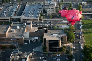 The Bank of American Fork piggy bank balloon flies through the air before crash landing near Utah Valley Regional Medical Center during America's Freedom Festival Balloon Fest in Provo, Utah, Thursday, July 2, 2015, |Photo by Grant Hindsley/The Daily Herald via AP, St. George News