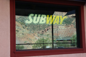 A Subway sign in the window of Izzy Poco, which now might be able to open, Springdale, Utah, July 17, 2015 | Photo by Nataly Burdick, St. George News