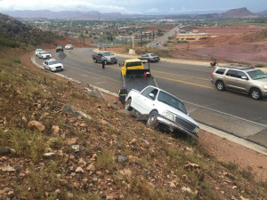 A driver loses control of his truck and runs into an embankment on Foremaster Drive, St. George, Utah, July 18, 2015 | Photo by Michael Durrant, St. George News