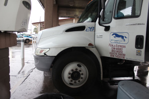 Damage to a semi-truck after water on the roadway kept it from braking fast enough, hitting the back of a Toyota Camry, July 18, 2015 | Photo by Nataly Burdick, St. George News