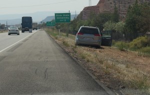 An elderly woman escaped injury Wednesday when she drove her van through a chain link fence and onto the shoulder of I-15, St. George, Utah, August 19, 2015 | Photo by Ric Wayman, St. George News