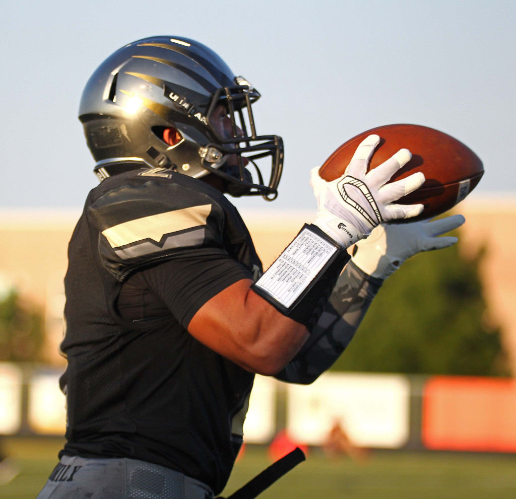 Stetson Wood makes a catch and heads to the end zone for a Desert Hills touchdown, Desert Hills vs. Jordan, Football, St. George, Utah, Aug. 21, 2015, | Photo by Robert Hoppie, ASPpix.com, St. George News