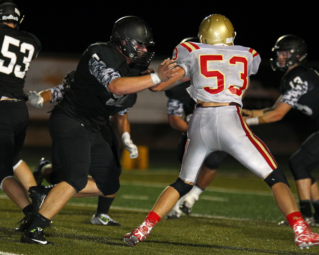 Tyler Heaton takes on a Judge defender, Pine View vs. Judge Memorial, Football, St. George, Utah, Aug. 21, 2015, | Photo by Robert Hoppie, ASPpix.com, St. George News