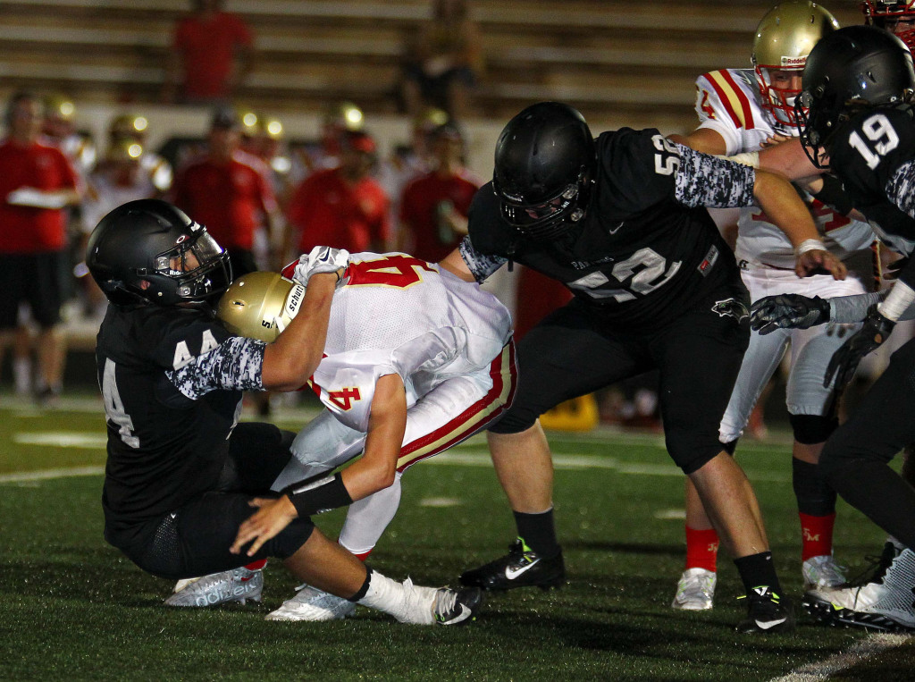 Dillan Robertson (44) sacks the Judge quarterback in last year's meeting in St. George, Aug. 21, 2015, | Photo by Robert Hoppie, ASPpix.com, St. George News