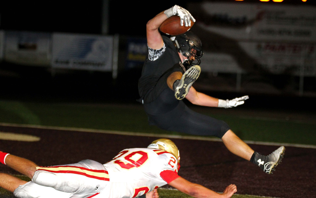 Pine View running back Kobe Topalian dives in to the Panther end zone for the game winning score in double over time, Pine View vs. Judge Memorial, Football, St. George, Utah, Aug. 21, 2015, | Photo by Robert Hoppie, ASPpix.com, St. George News