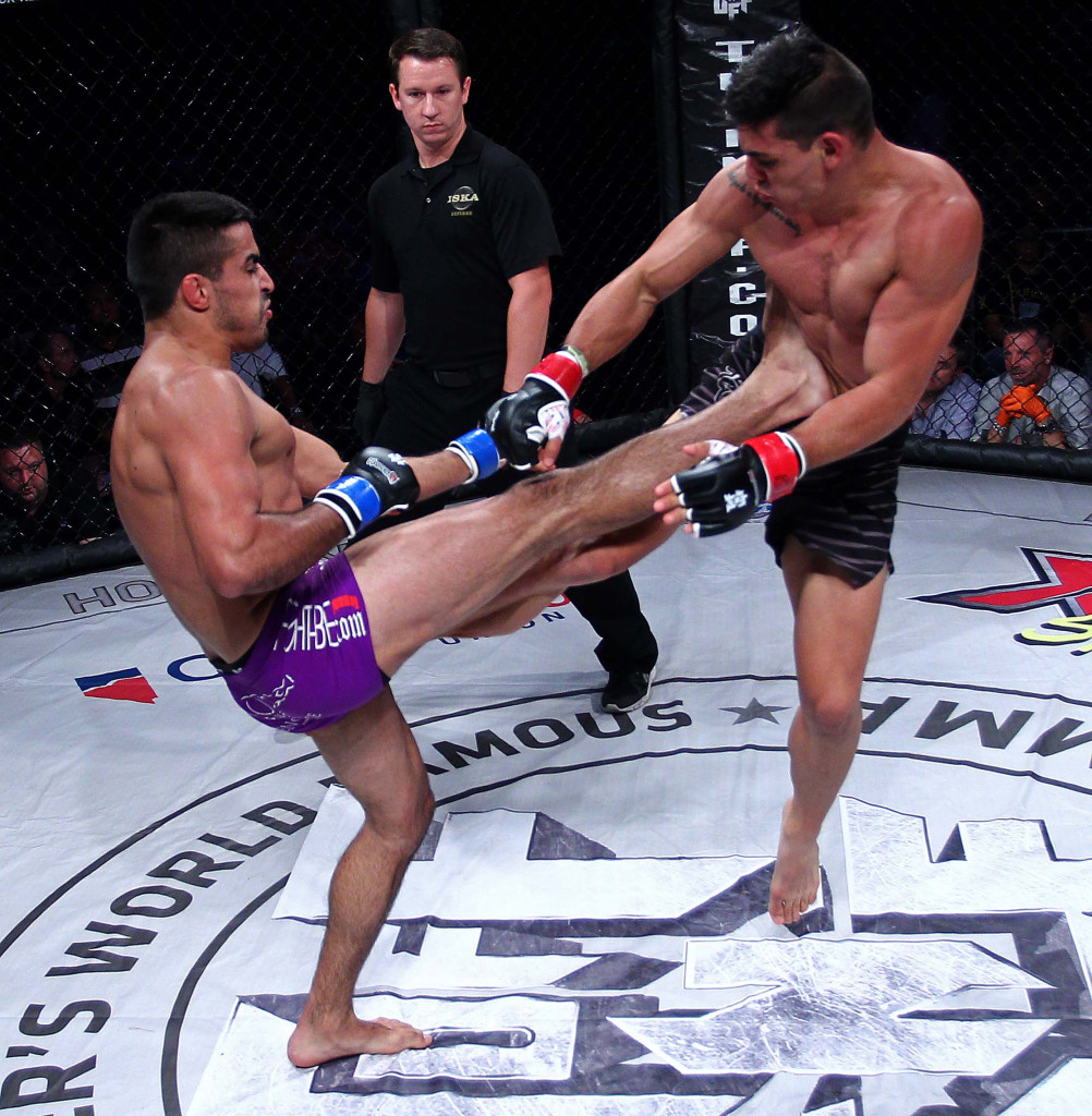 Rocky Cantu (purple shorts) vs. Hugo Flores (black shorts),Mayhem in Mesquite VII Mixed Martial Arts event at the CasaBlanca, Mesquite, Nevada, Aug. 22, 2015, | Photo by Robert Hoppie, ASPpix.com, St. George News