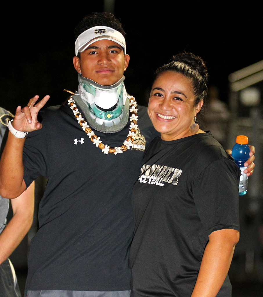 Nephi Sewell (with his mother on the Desert Hills sideline) got the all-clear message from doctors a year after a scary neck injury. File photo from Desert Hills vs. Foothill Nev., Football, St. George, Utah, Aug. 28, 2015, | Photo by Robert Hoppie, ASPpix.com, St. George News