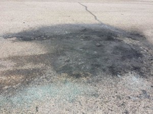 A charred spot is left on the road where a vehicle fire in Cedar City, Utah, Aug. 1, 2015 | Photo by David Juarez, St. George News