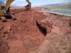 Excavator clearing the debris near a box culvert from the mudslide on Highway 89-A west of Marble Canyon near milepost 550, Coconino County, Arizona, Aug. 9, 2015 | Photo courtesy of Arizona Department of Transportation, St. George News